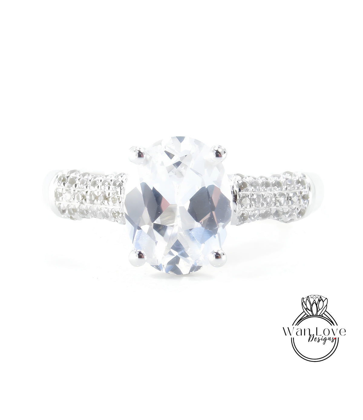 A close-up view of a diamond engagement ring with a large oval-shaped gemstone set in a silver band.