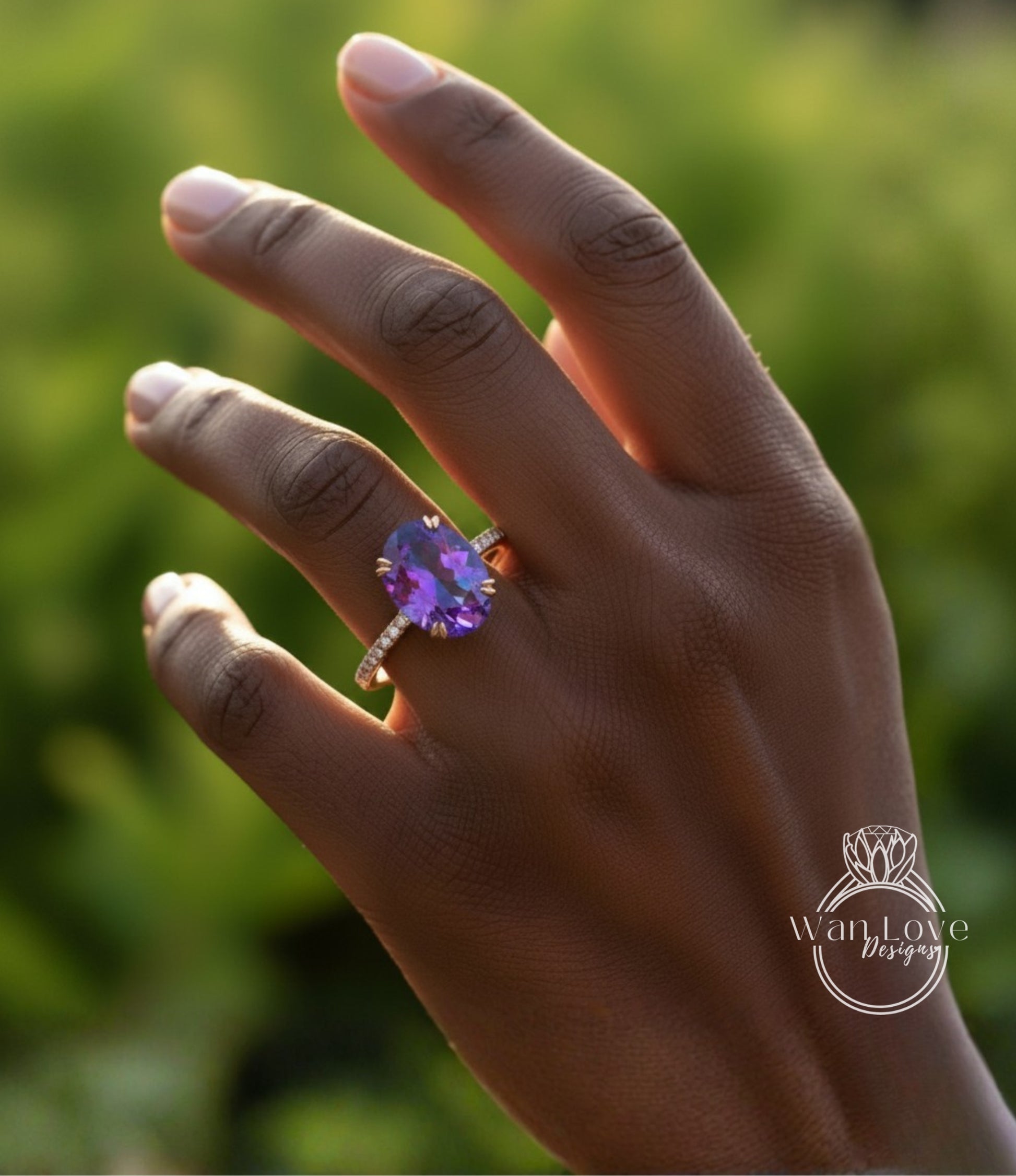 A close-up of a hand wearing a ring with a large purple gemstone, set in a gold band.