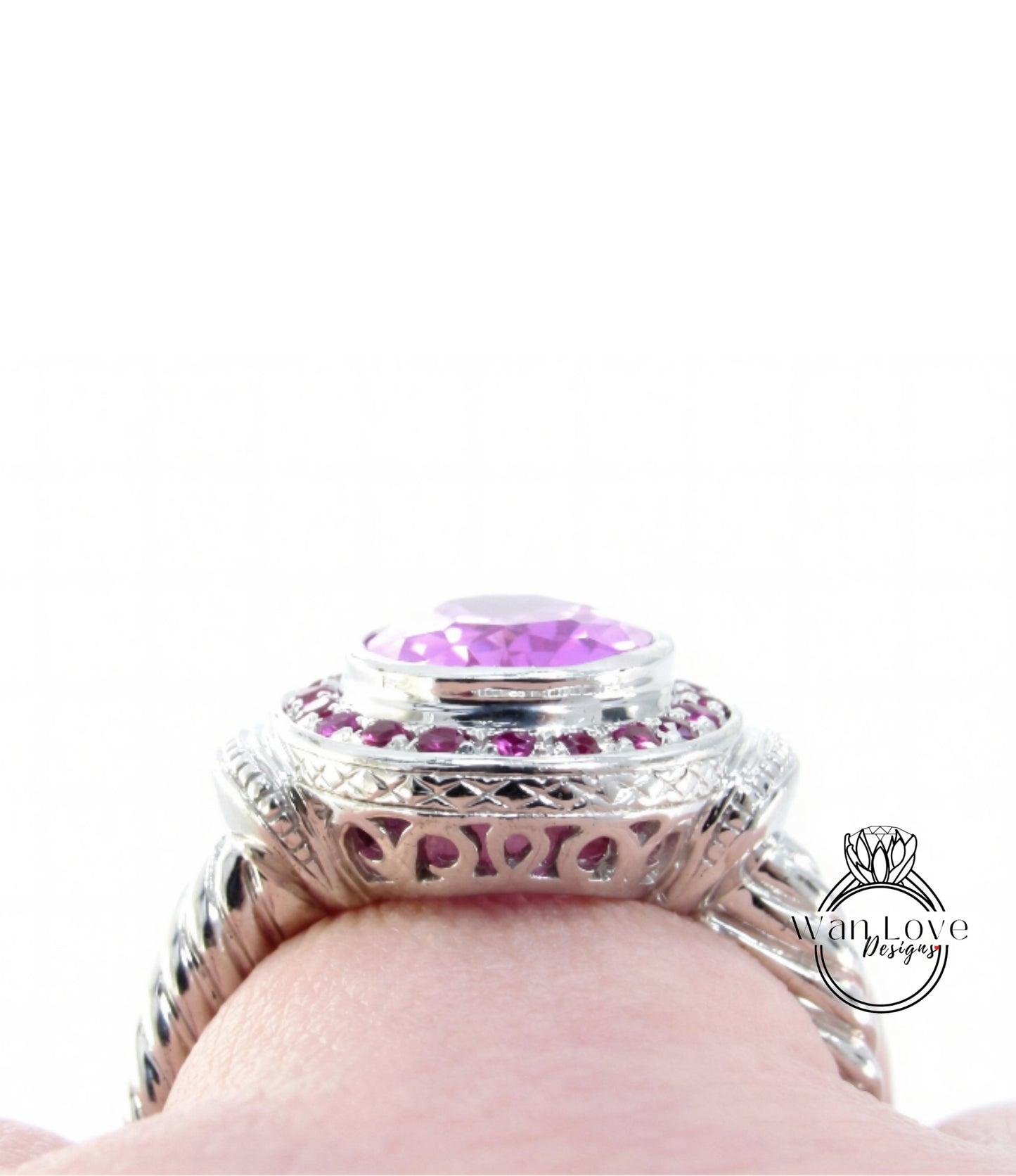A close-up view of a silver ring with a large purple gemstone, showcasing the intricate design and craftsmanship.
