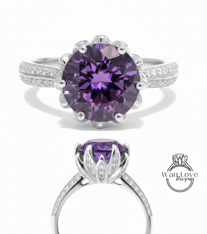 a beautiful purple gemstone ring with a large central gemstone surrounded by smaller stones. The ring is set in a silver band with a scalloped edge, and the image includes a close-up view of the ring's details, as well as a full view of the ring on a white background.