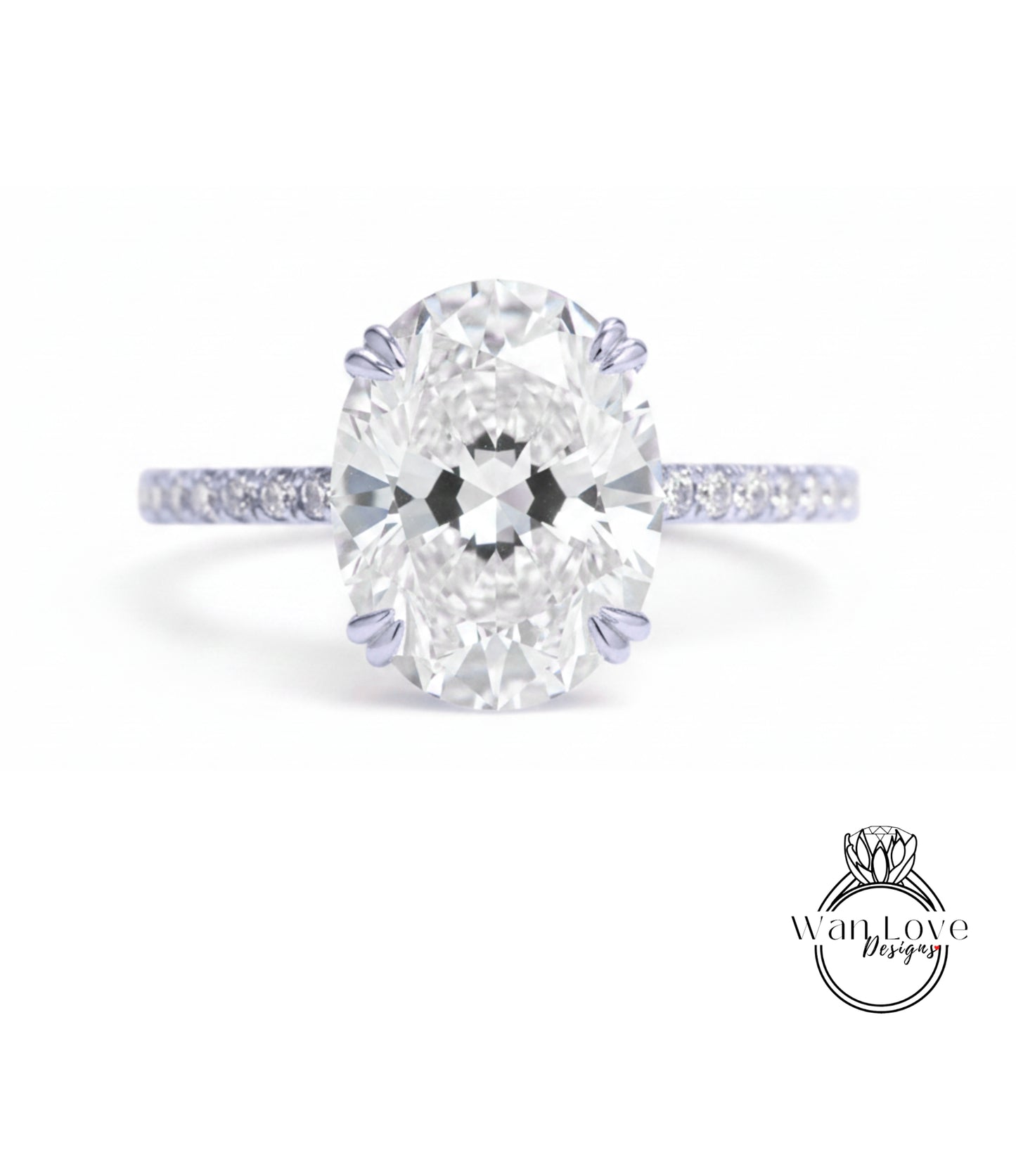 A close-up of a diamond engagement ring with a large oval-shaped diamond set in a band of smaller diamonds.