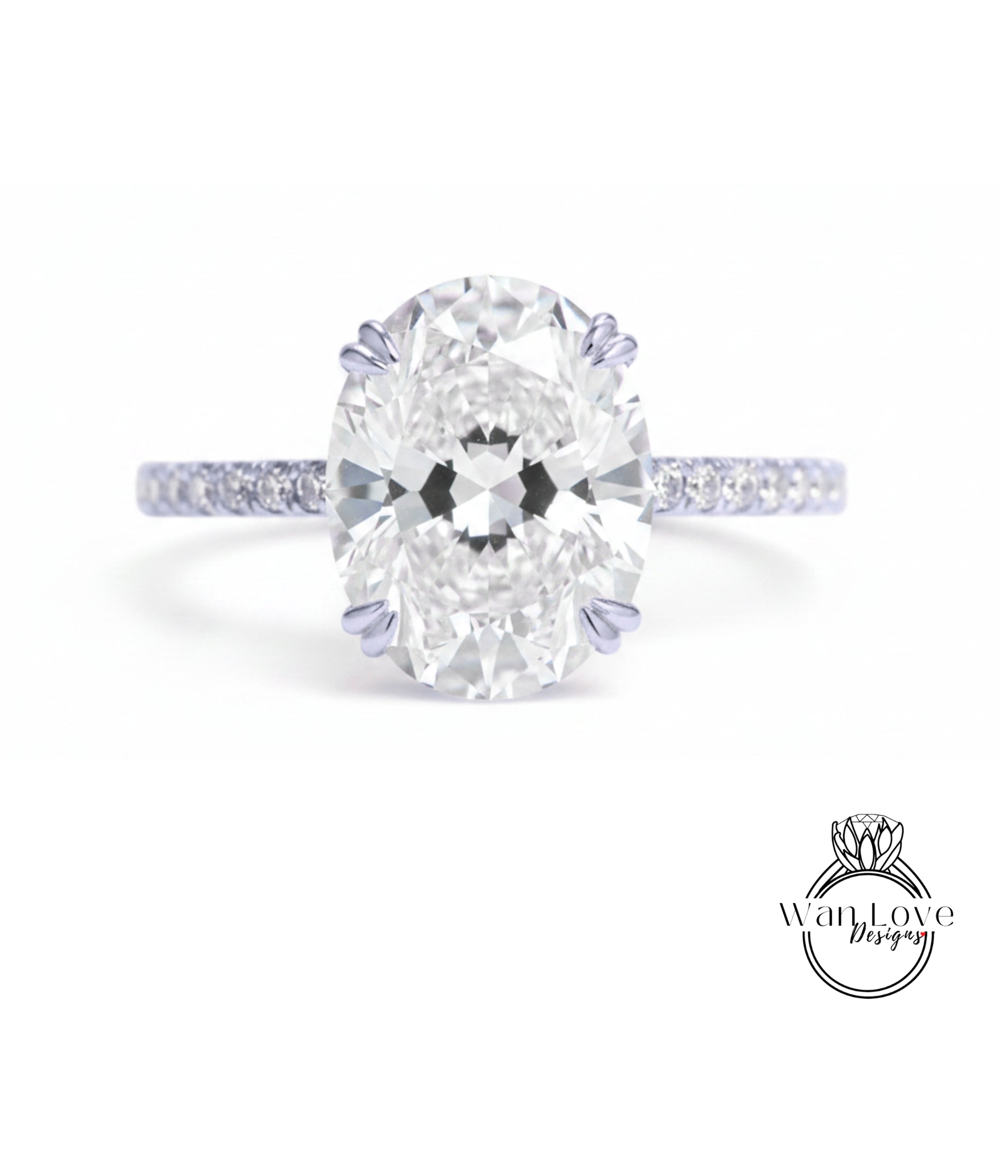 A close-up of a diamond engagement ring with a large oval-shaped diamond set in a band of smaller diamonds.
