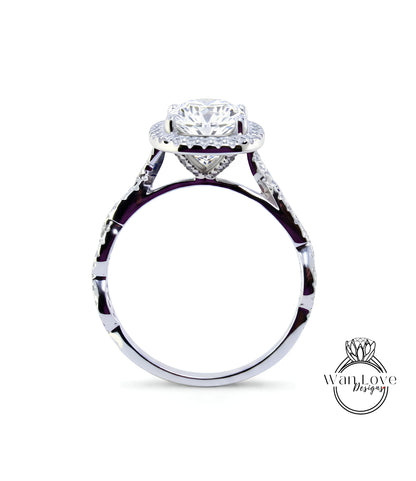 A close-up view of a silver engagement ring with a large, round diamond set in the center, surrounded by smaller diamonds.