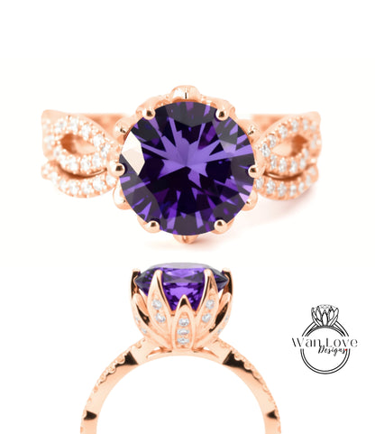 a beautiful ring with a large purple gemstone set in a rose gold band.