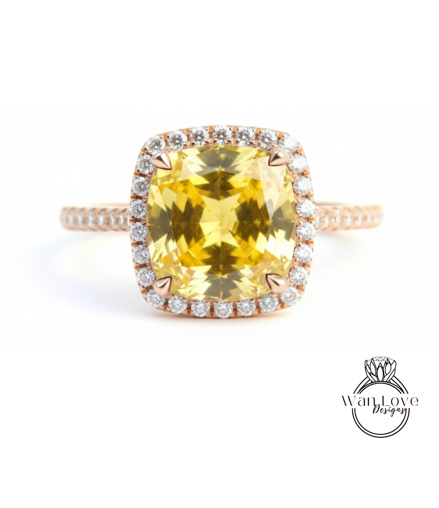 A large yellow gemstone ring with a halo of smaller diamonds around the center stone.