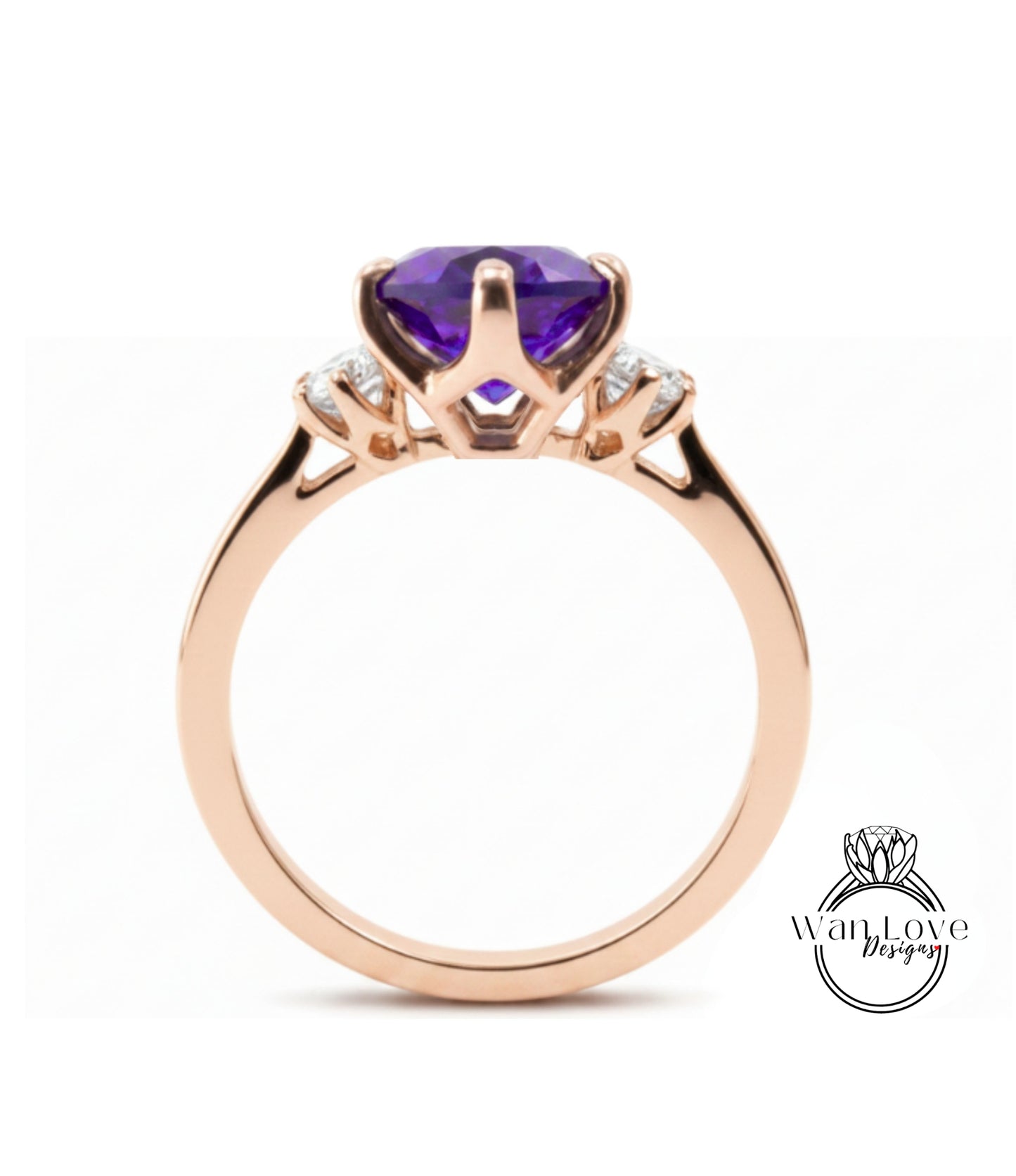 A gold ring with a large purple gemstone, likely an amethyst, set in a three-prong design.