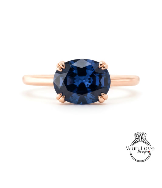A gold ring with a large blue gemstone set in the center.