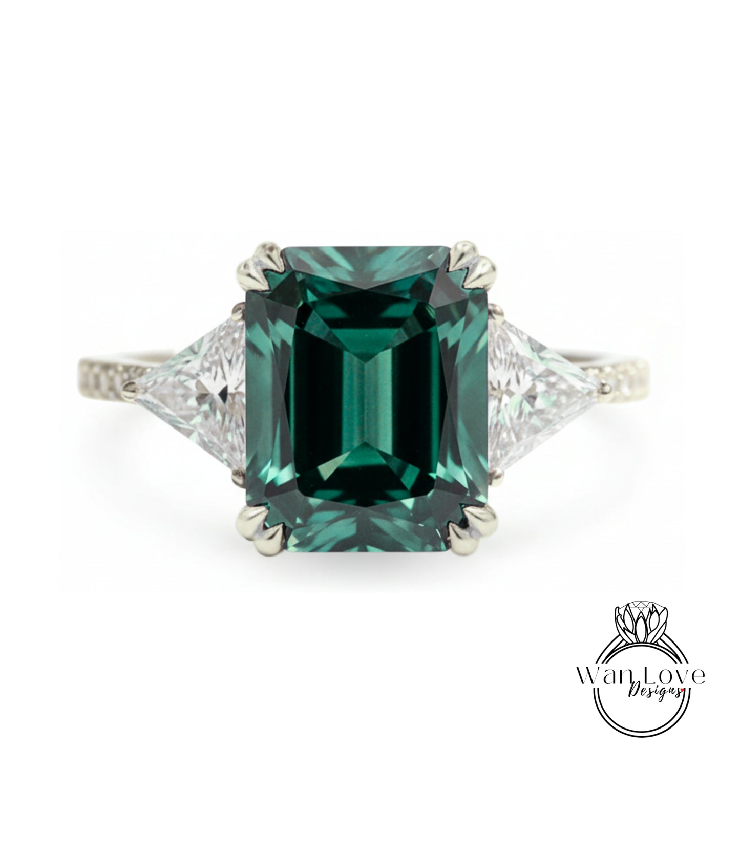 A large, green gemstone engagement ring with a diamond-encrusted band.