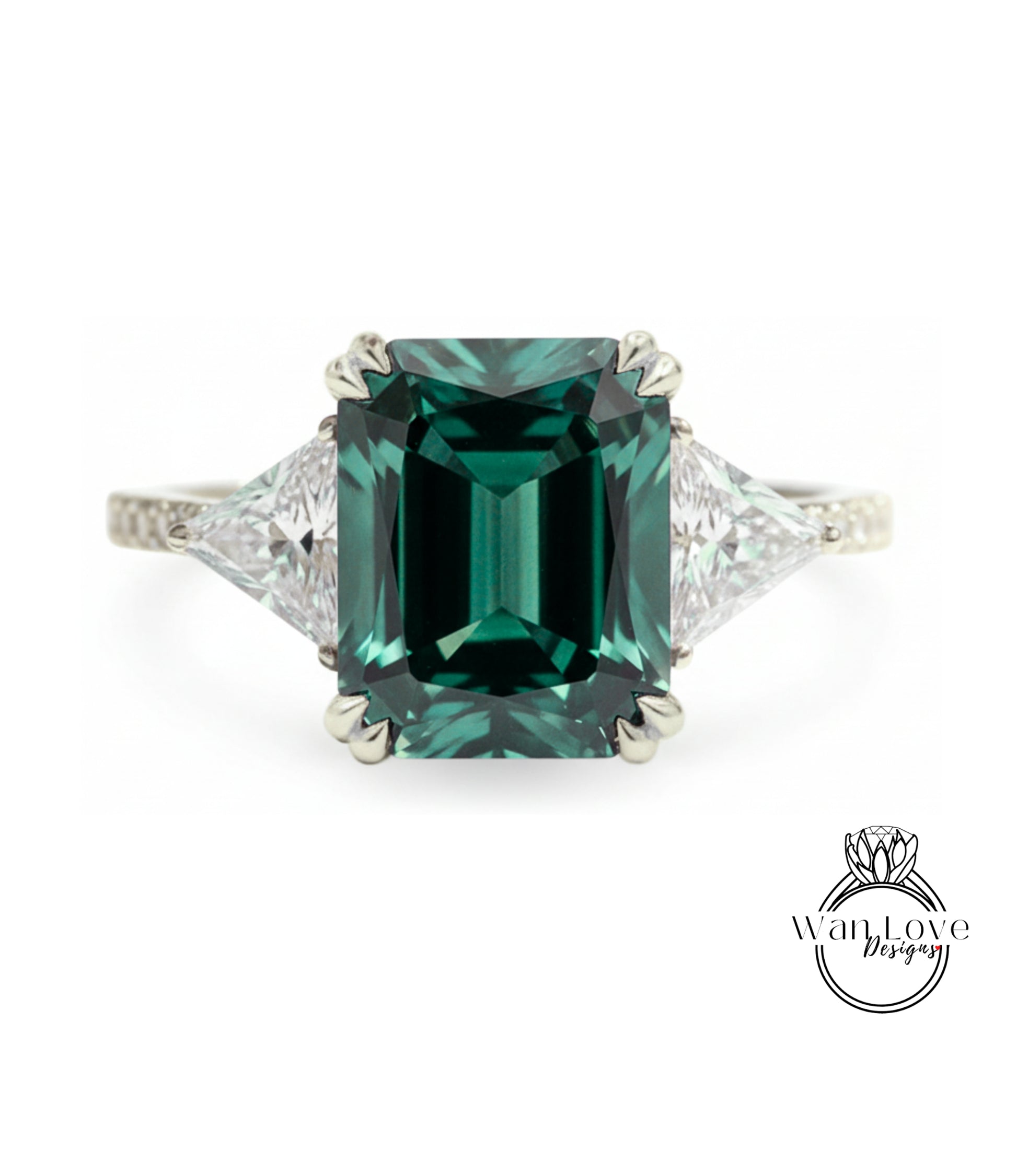 A large, green gemstone engagement ring with a diamond-encrusted band.