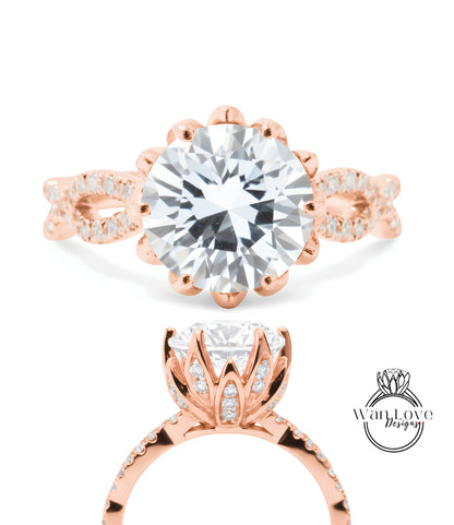 a beautiful rose gold engagement ring with a large round brilliant-cut diamond at the center, surrounded by smaller diamonds and set in a delicate flower-like design.
