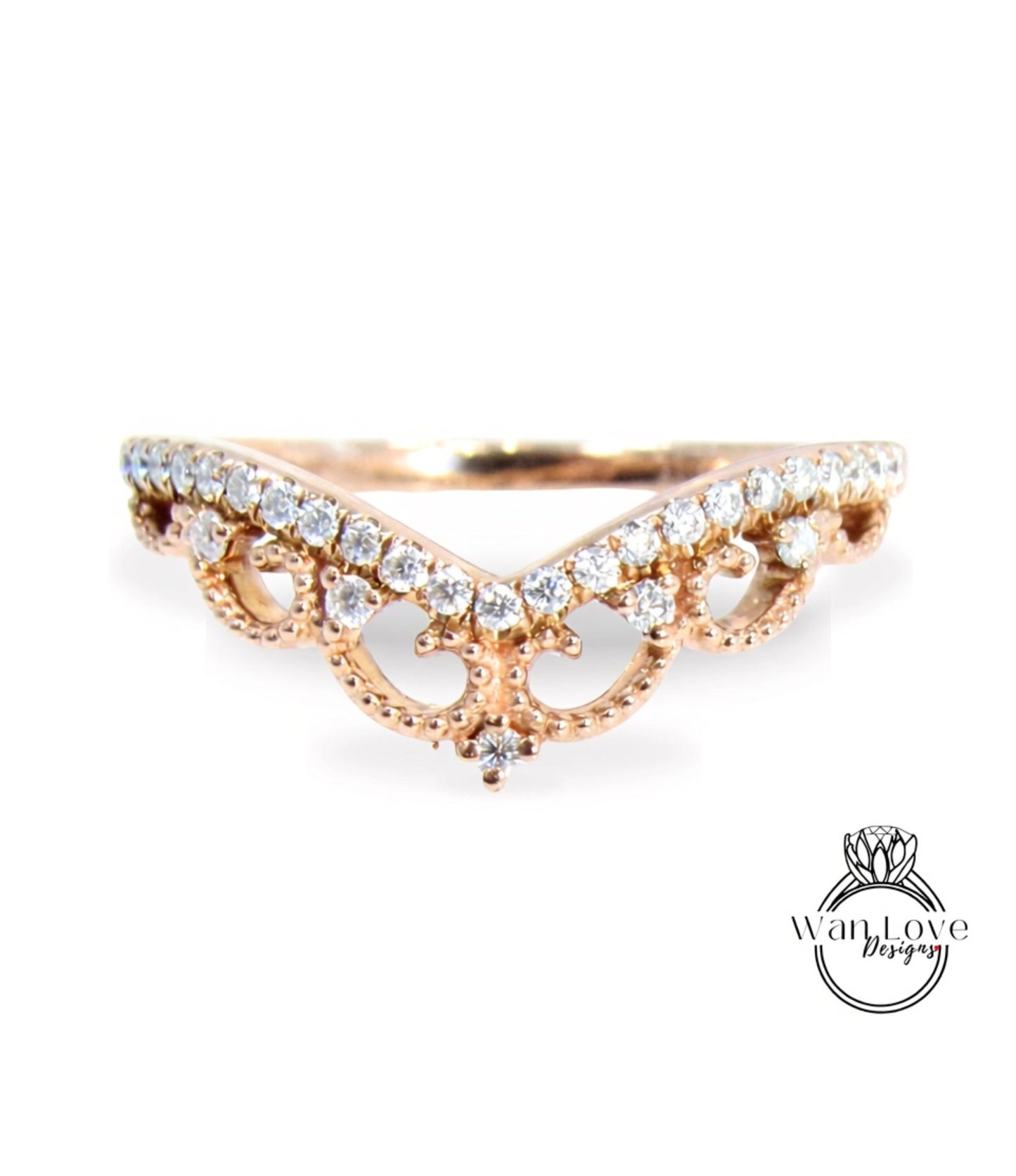 A gold ring with a decorative band adorned with small diamonds.