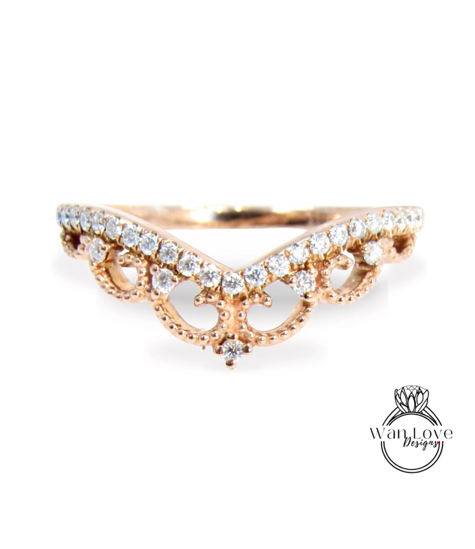 A gold ring with a decorative band adorned with small diamonds.