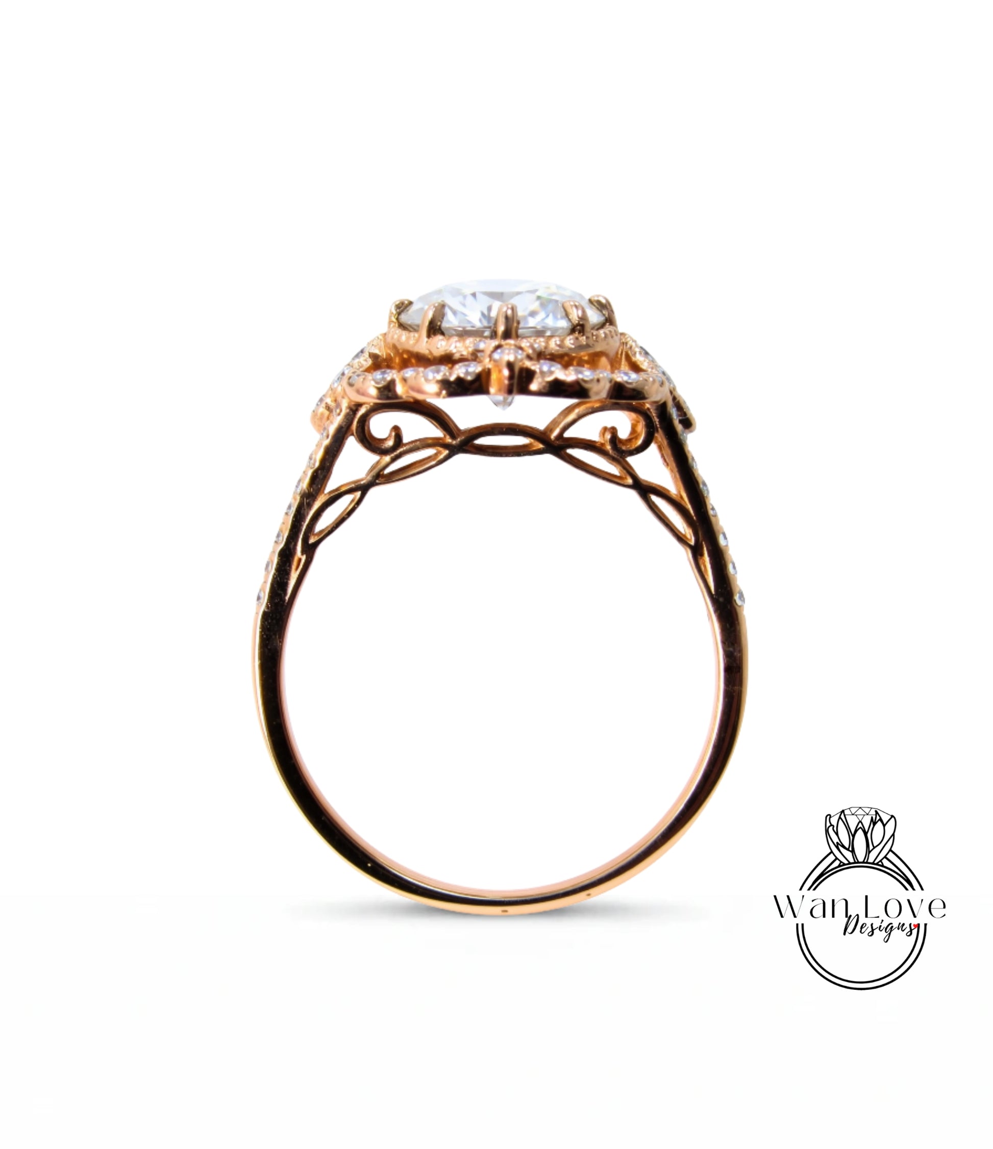 A gold ring with a large central stone and intricate metalwork detailing.
