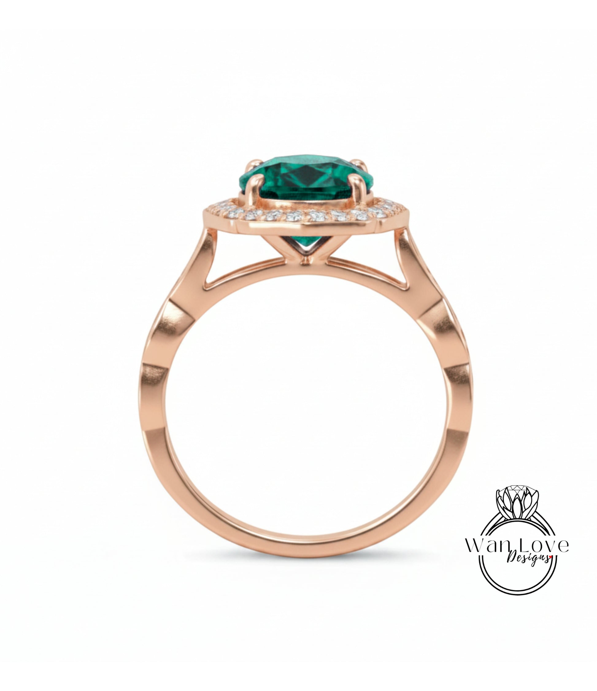 A rose gold ring with a large green gemstone set in the center, surrounded by smaller diamonds.