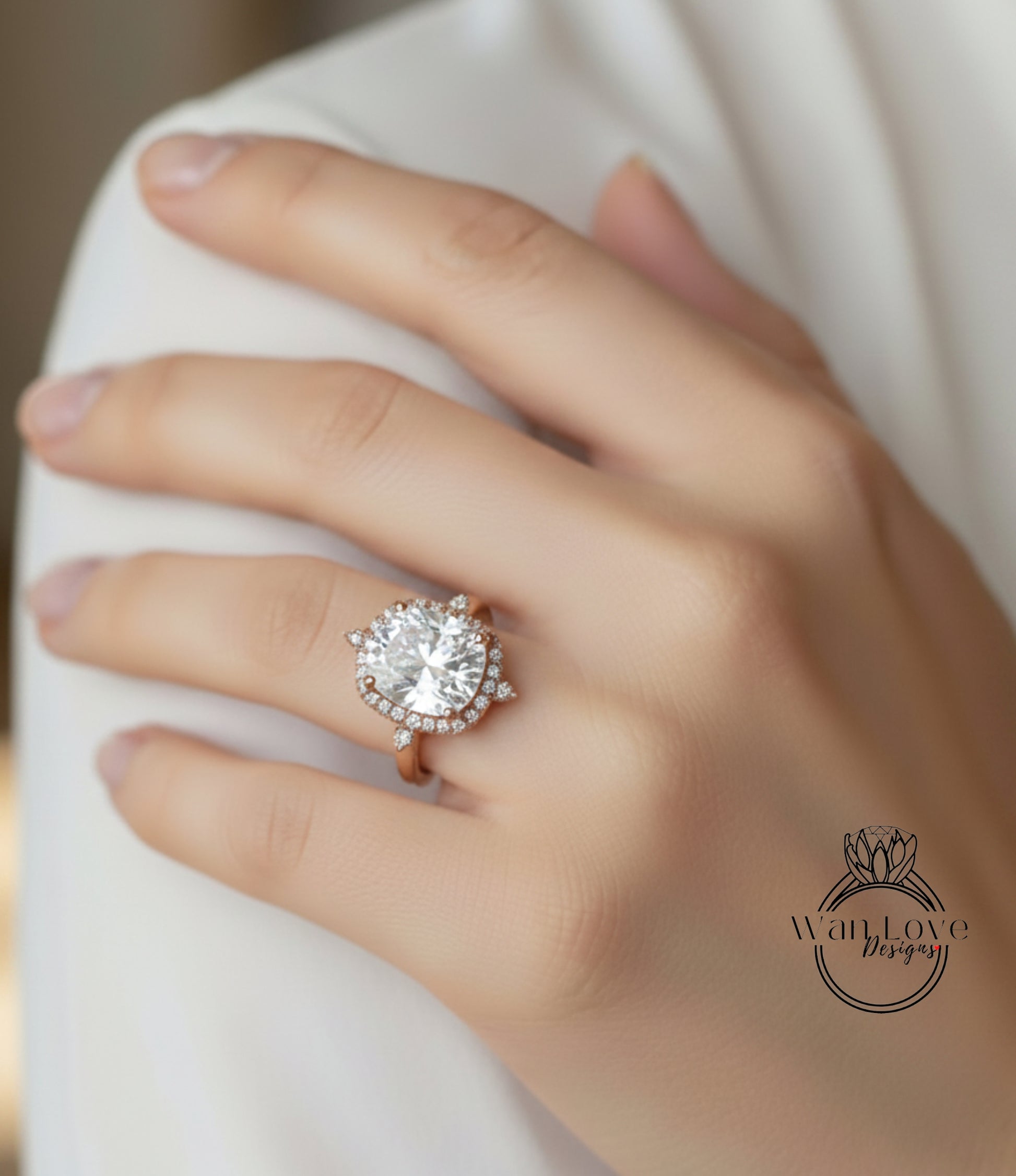 A close-up of a person's hand wearing a large, sparkling diamond ring on the ring finger.