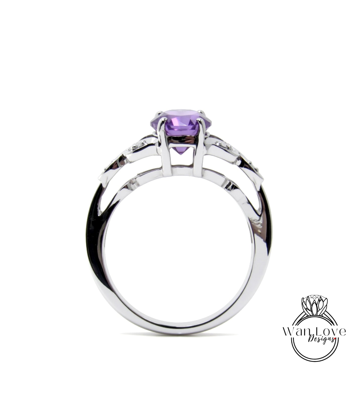 A silver ring with a purple gemstone, possibly a diamond, set in the center.