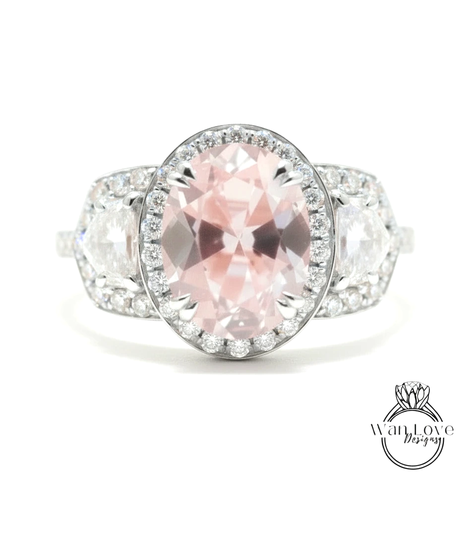 A close-up of a beautiful pink gemstone ring with a large oval-shaped gemstone surrounded by smaller diamonds.
