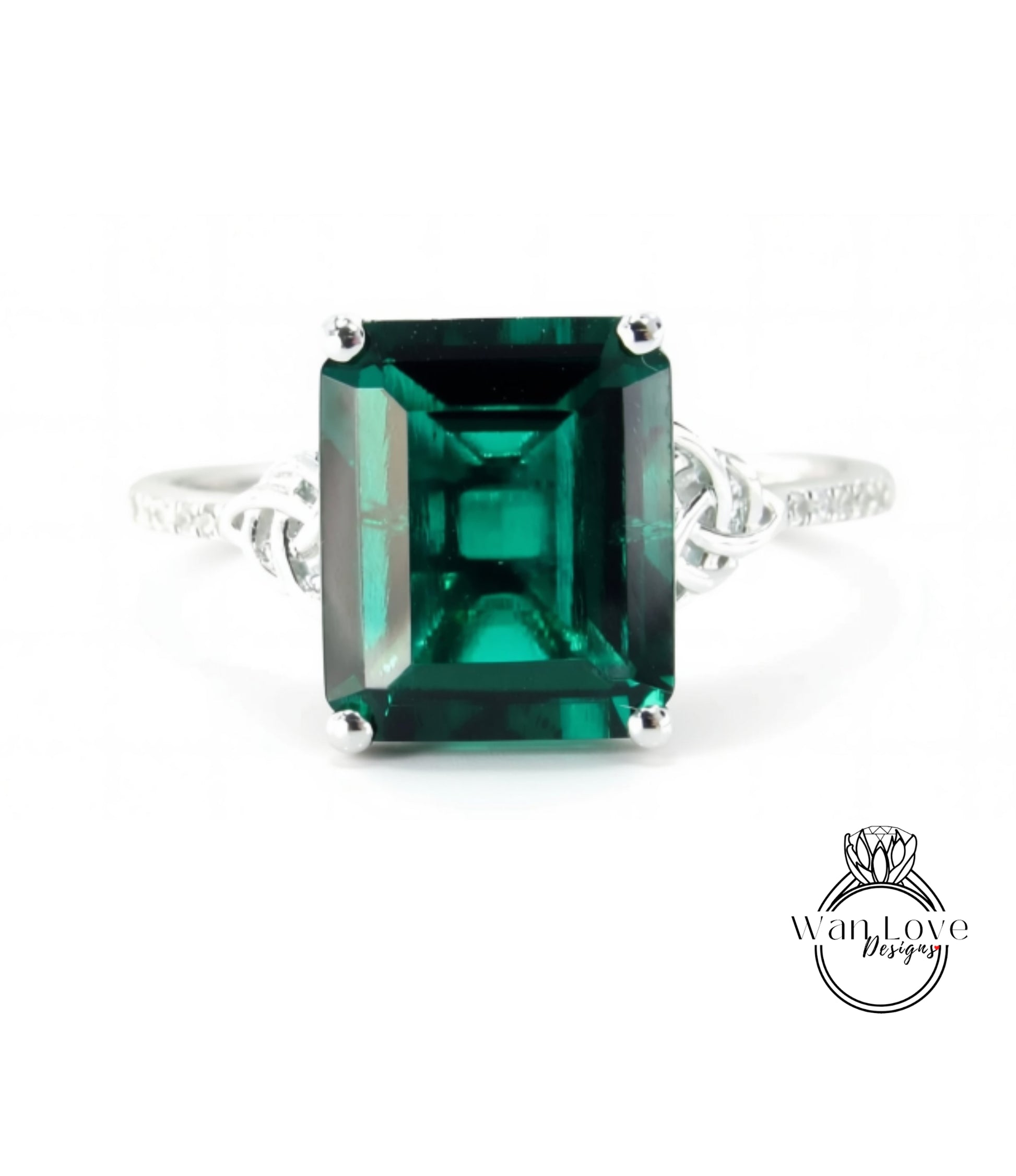 A large, green gemstone ring with a silver band.
