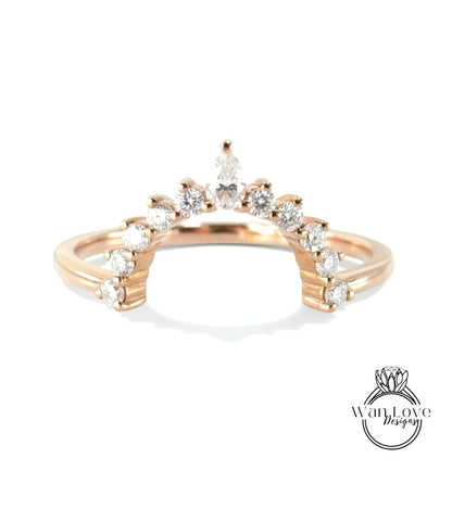 A gold ring with a large central diamond surrounded by smaller diamonds, creating a decorative design.