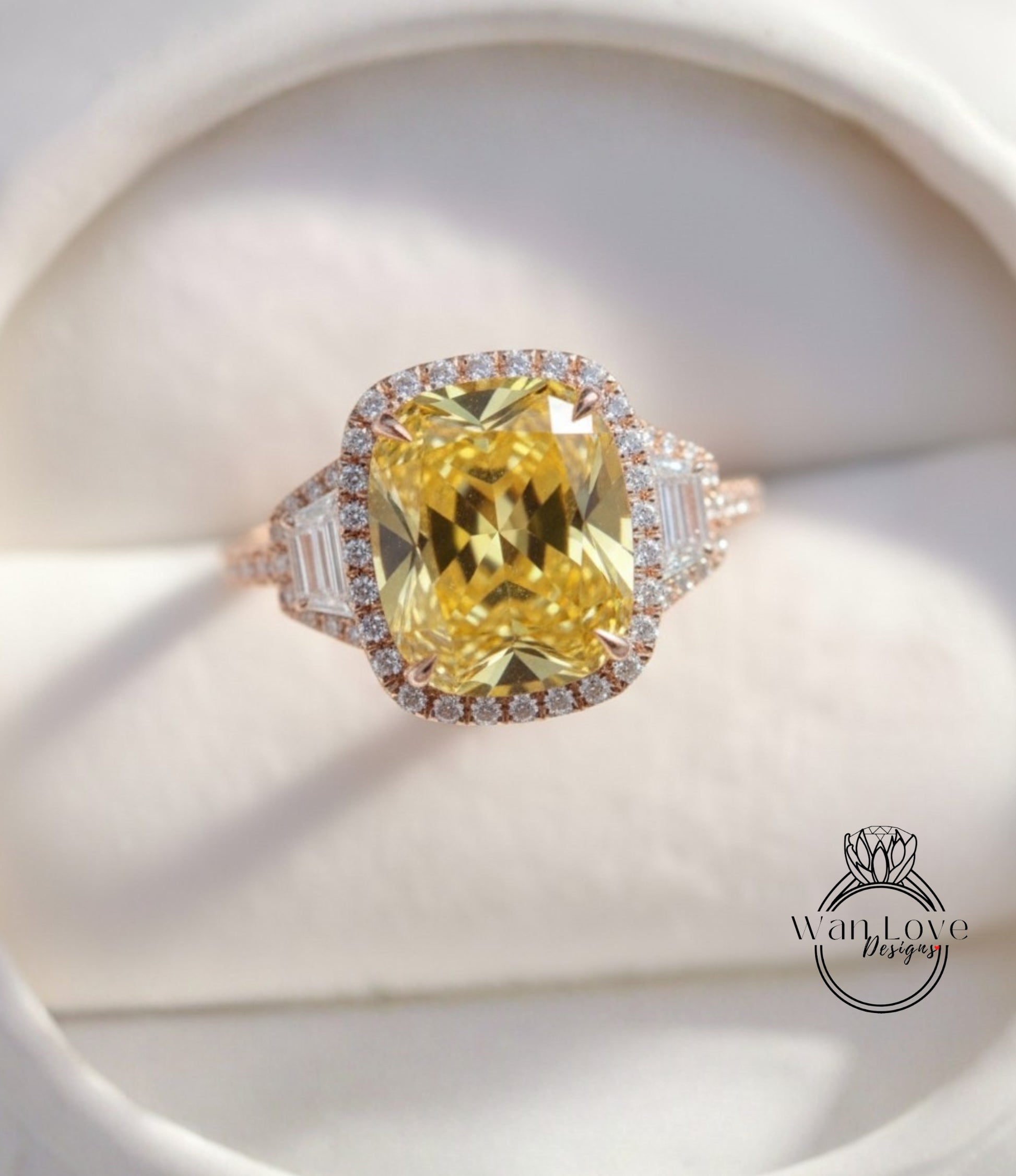 A large yellow diamond ring with a halo of smaller diamonds around the center stone, displayed on a white background.