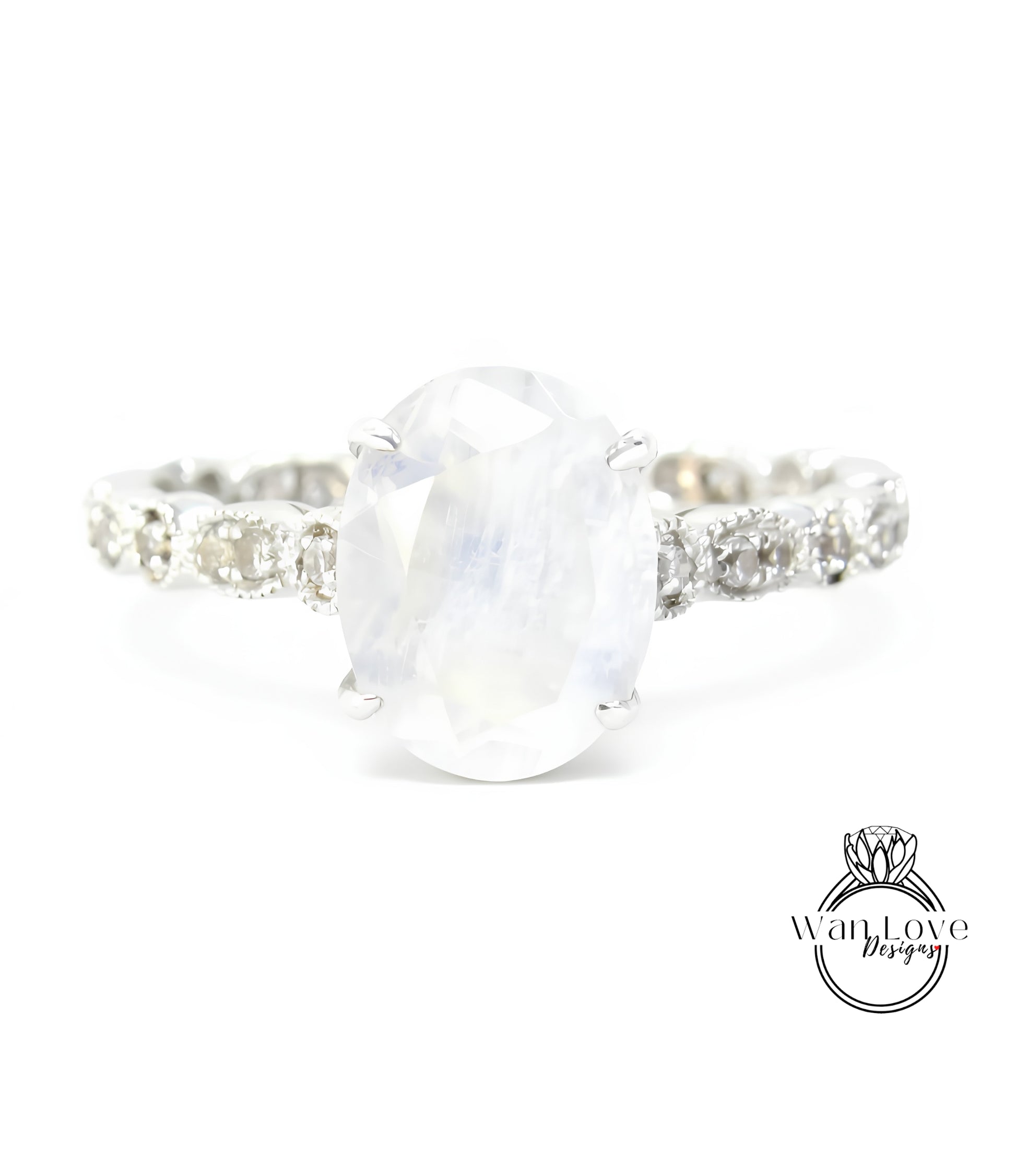 A close-up view of a silver ring with a large oval-shaped stone set in the center.