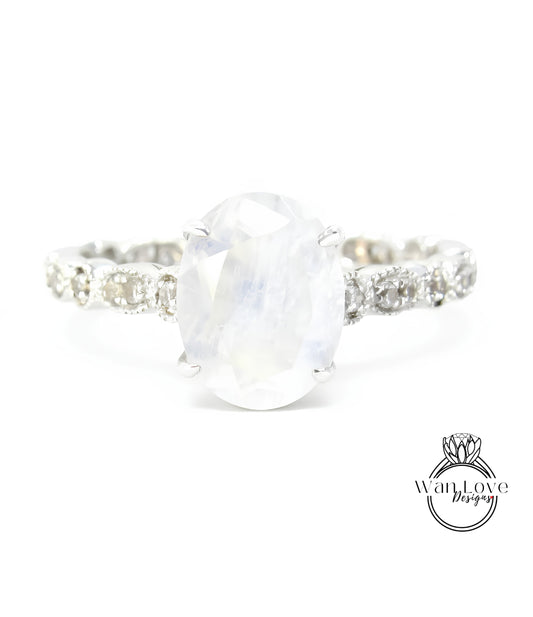 A close-up view of a silver ring with a large oval-shaped stone set in the center.