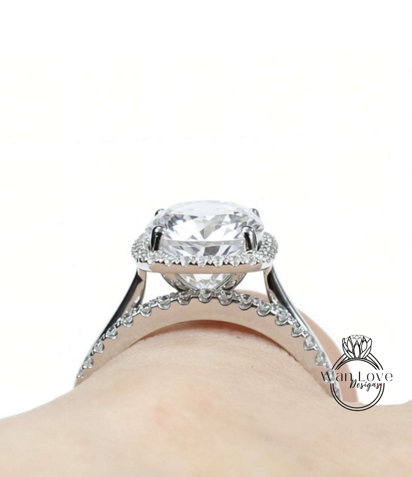A close-up view of a large, sparkling diamond engagement ring on a person's hand.