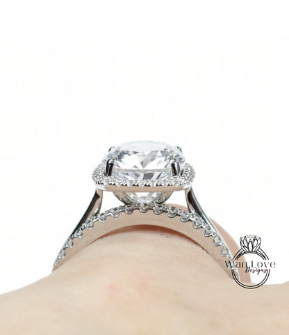 A close-up view of a large, sparkling diamond engagement ring on a person's hand.