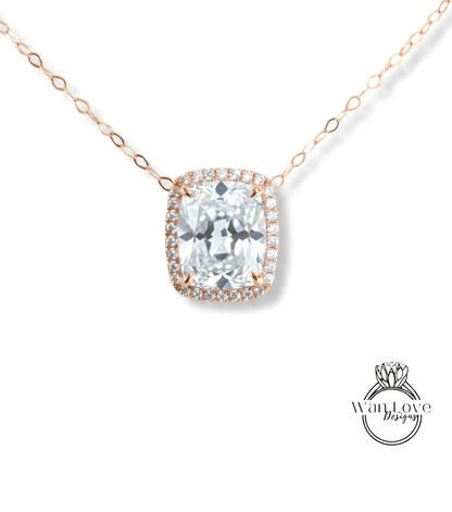 A necklace with a large, clear gemstone pendant, likely a diamond, surrounded by a halo of smaller diamonds.