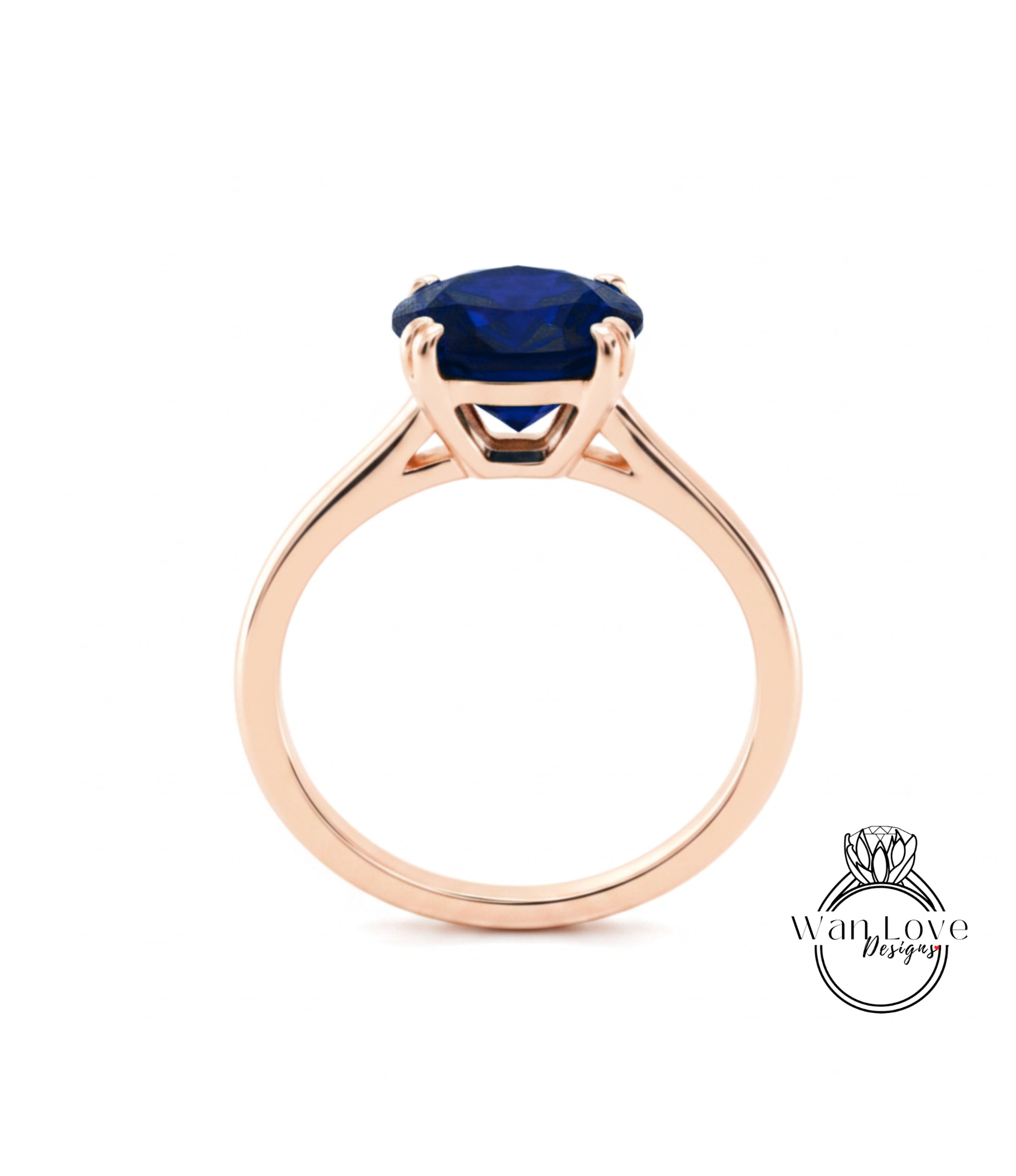 A gold ring with a large blue gemstone set in the center.