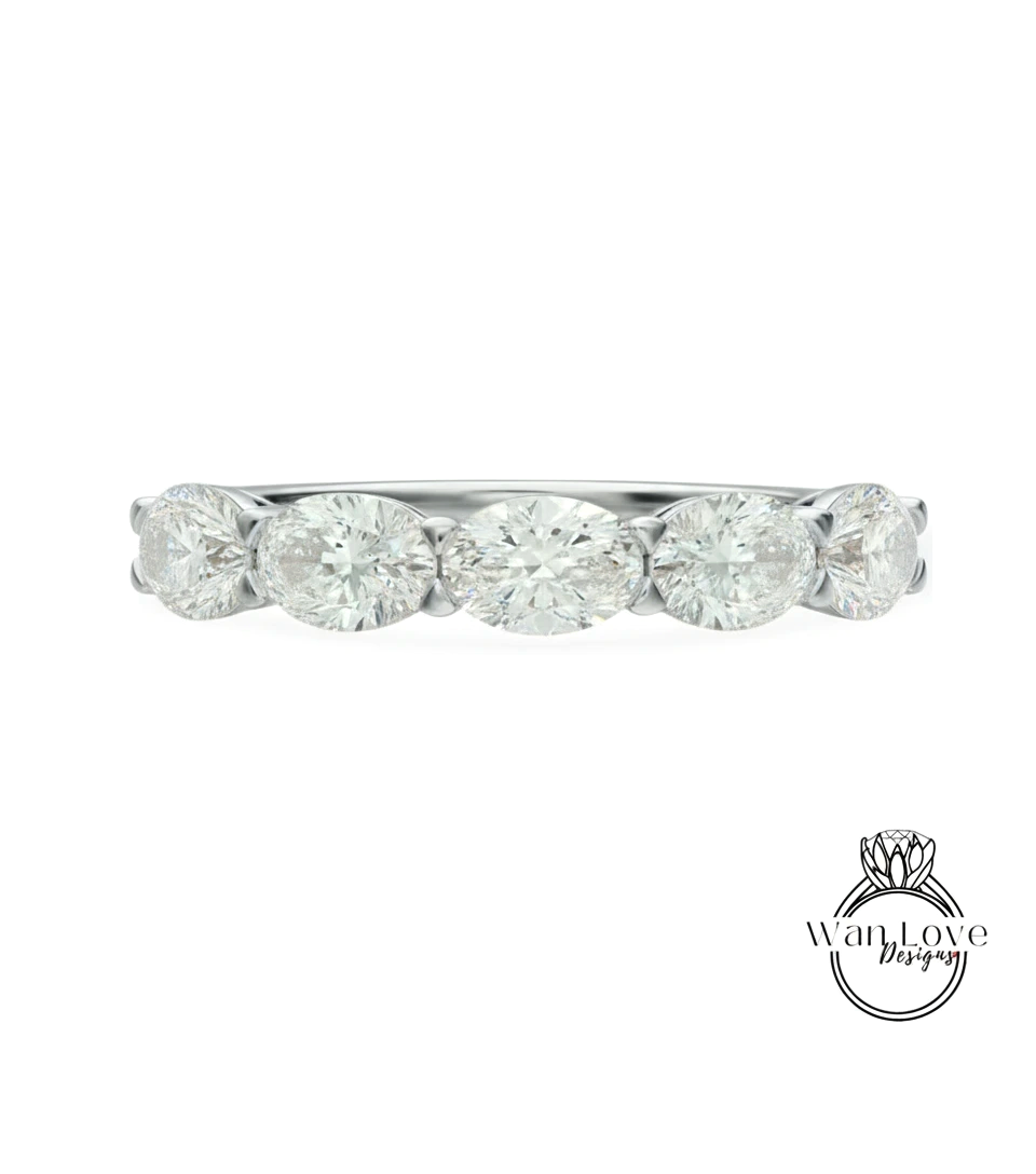 A silver band with a row of five oval-shaped diamonds set in it.