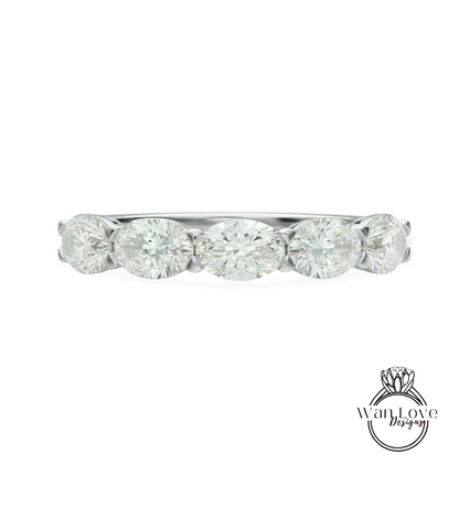 A silver band with a row of five oval-shaped diamonds set in it.