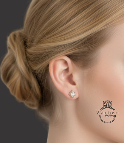 A close-up of a woman's ear with a diamond earring, her hair styled in a bun.