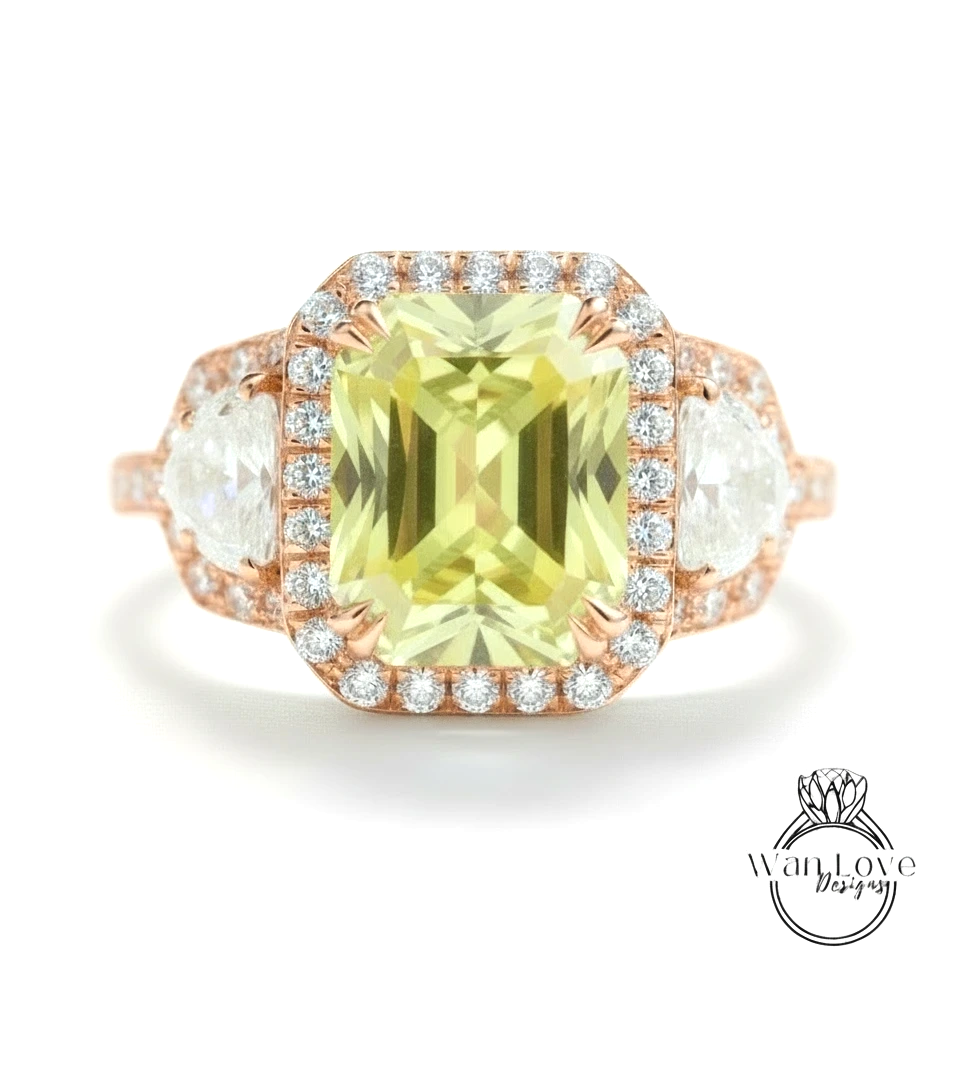 A large, yellow gemstone ring with a halo of smaller diamonds around it, set in a rose gold band.