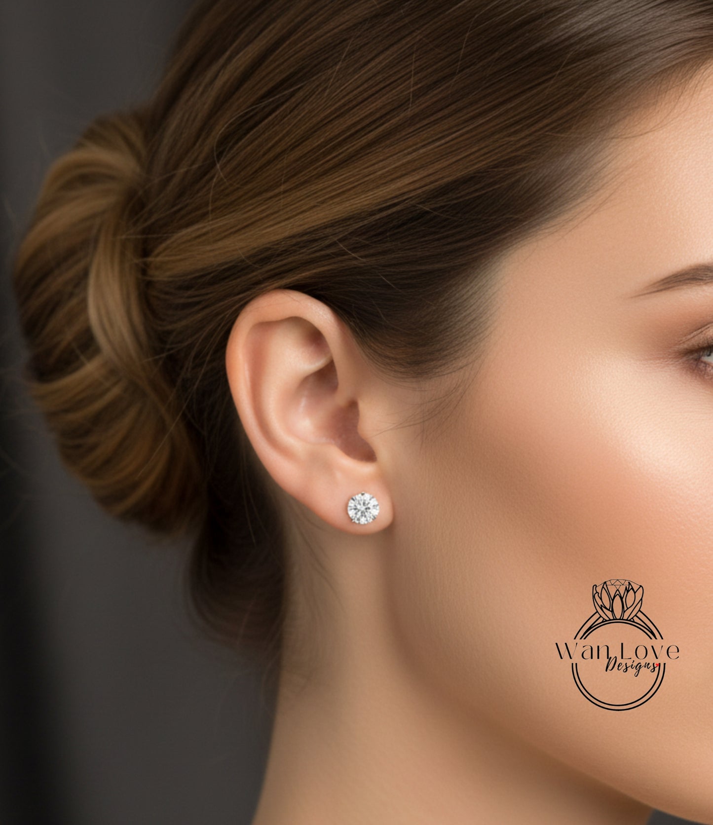 A close-up of a woman's face, focusing on her ear with a diamond earring.