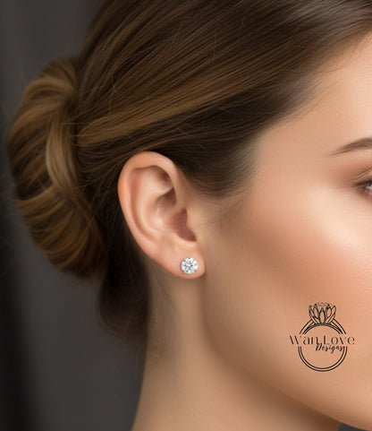 A close-up of a woman's face, focusing on her ear with a diamond earring.