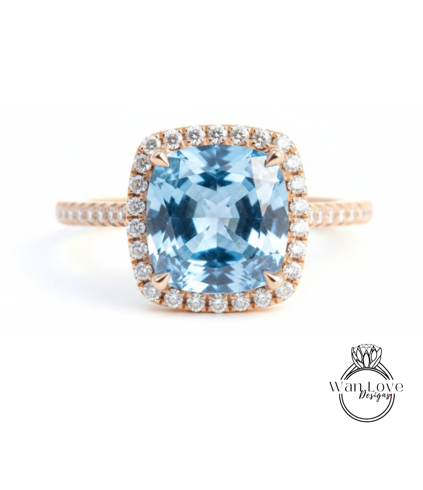 A stunning ring featuring a large, blue gemstone set in a halo of smaller diamonds, with a delicate gold band.