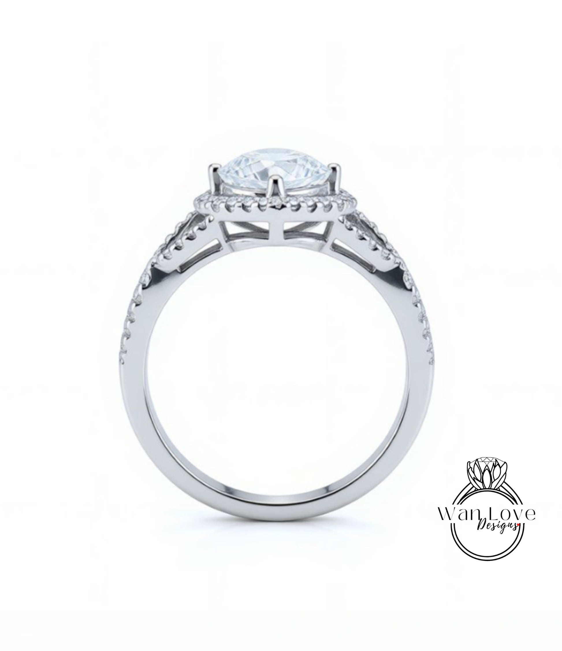 A silver engagement ring with a large central diamond and a halo of smaller diamonds around the center stone.