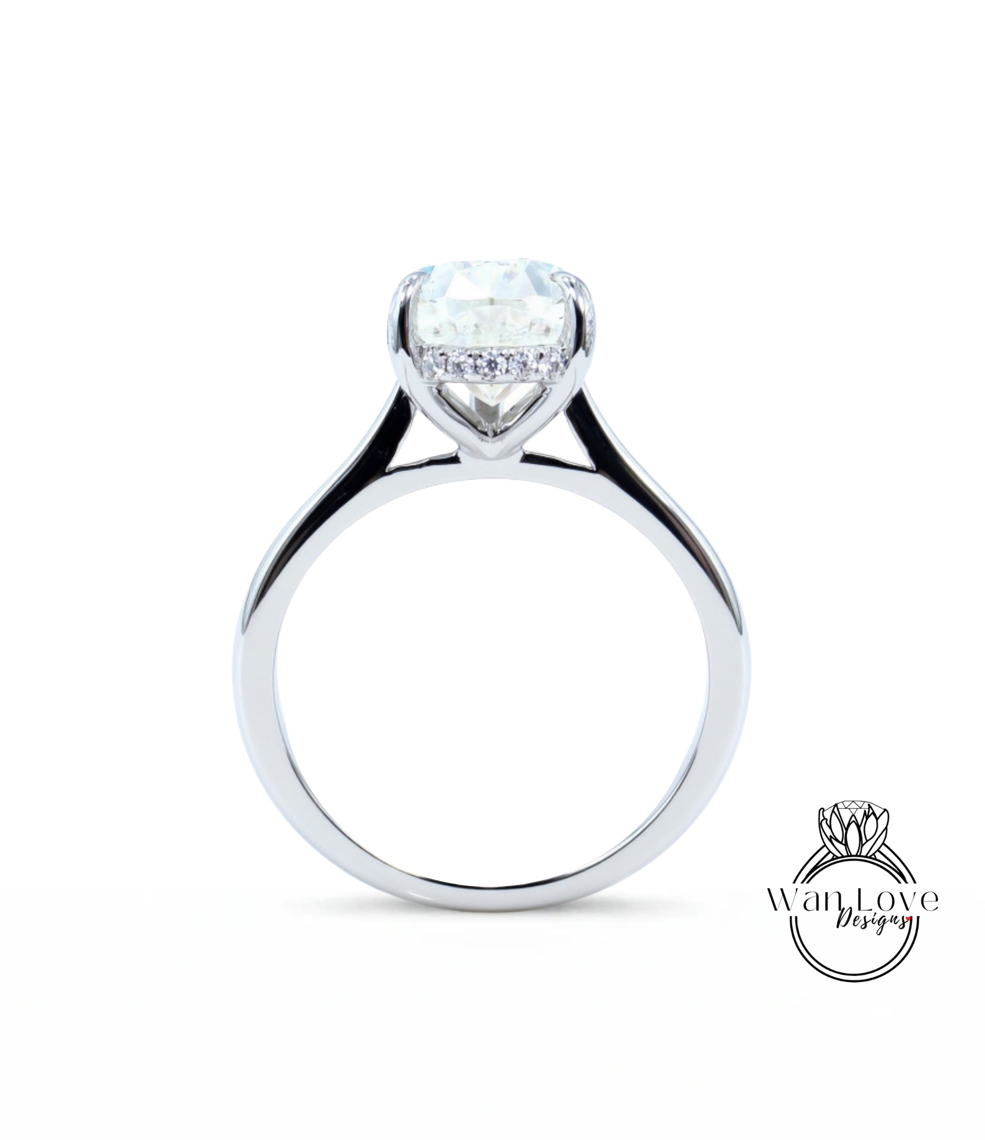 A silver engagement ring with a large diamond set in the center, showcasing the intricate design and craftsmanship of the jewelry piece.