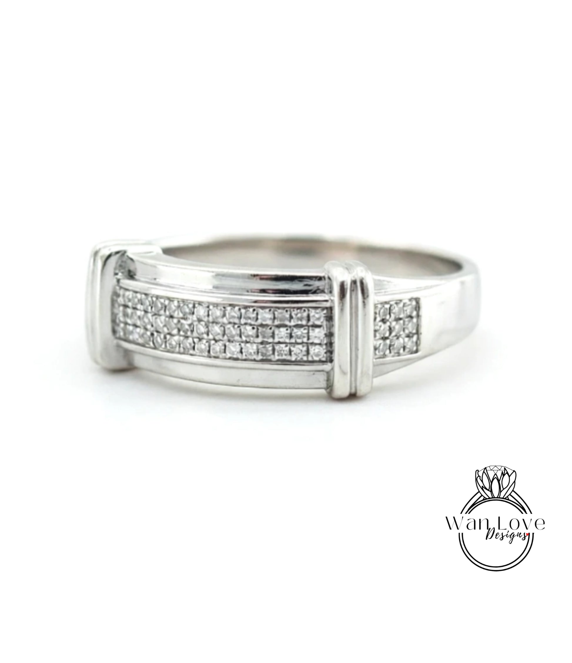 A silver ring with a row of small diamonds set in the band.