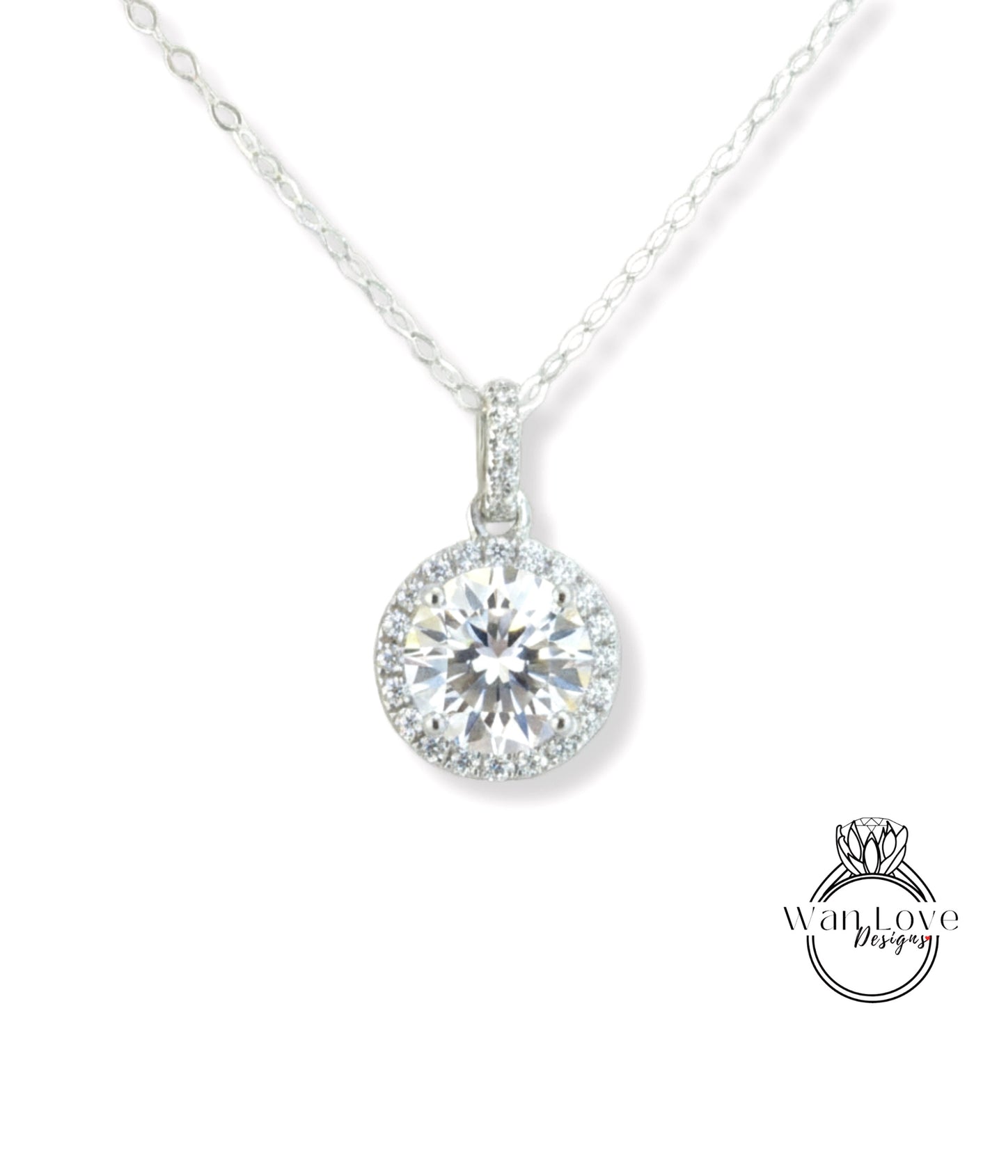 A necklace with a large, round diamond pendant hanging from a chain.