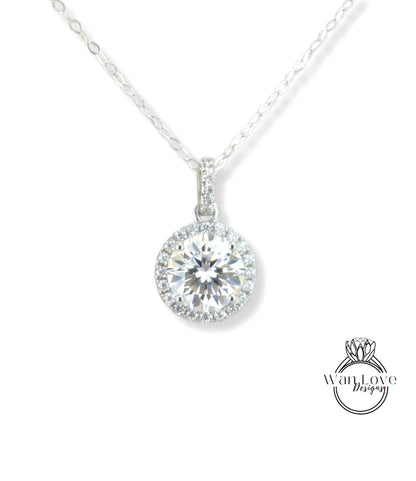A necklace with a large, round diamond pendant hanging from a chain.