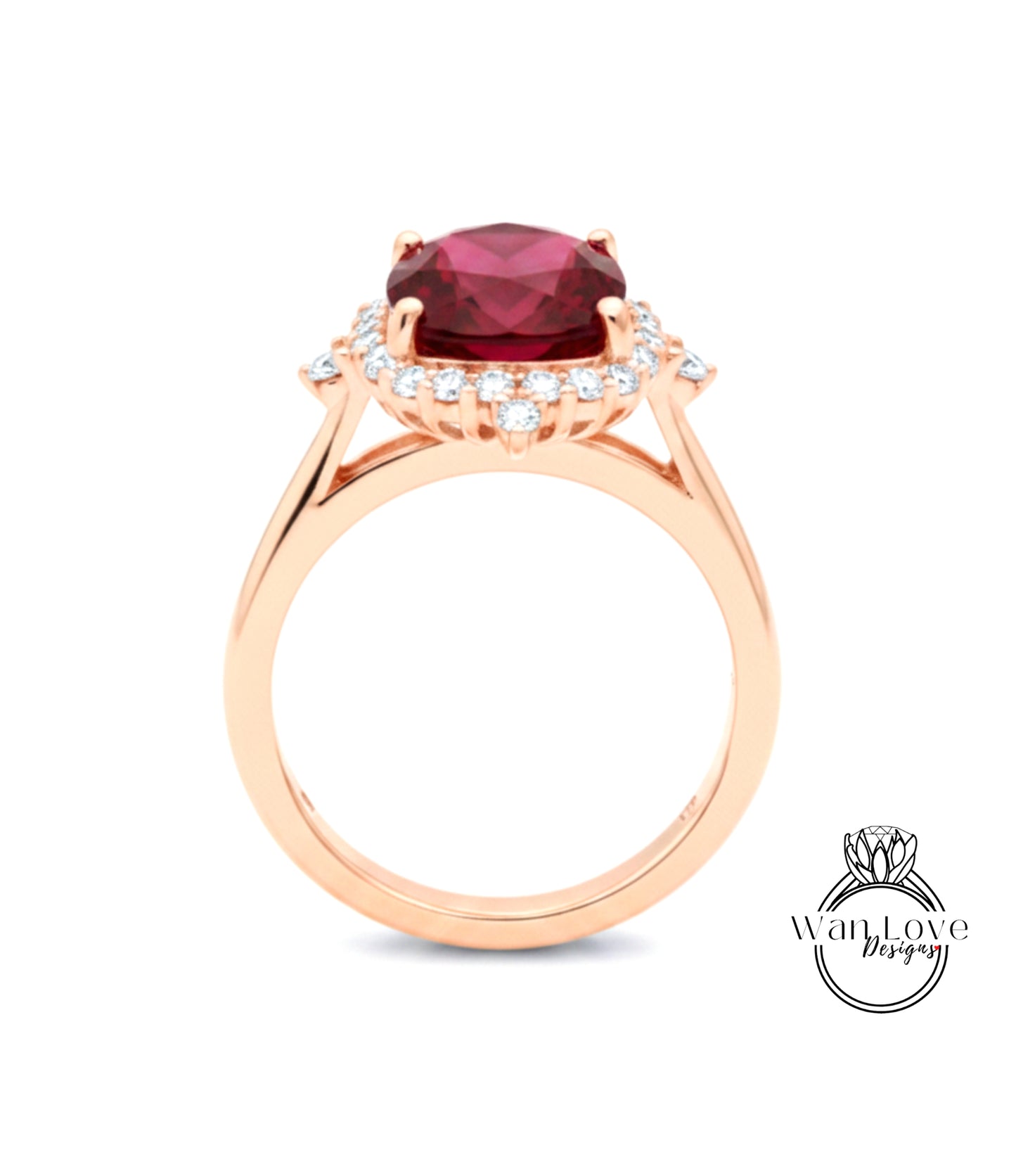 A gold ring with a large red gemstone, likely a ruby, set in a halo of smaller diamonds.