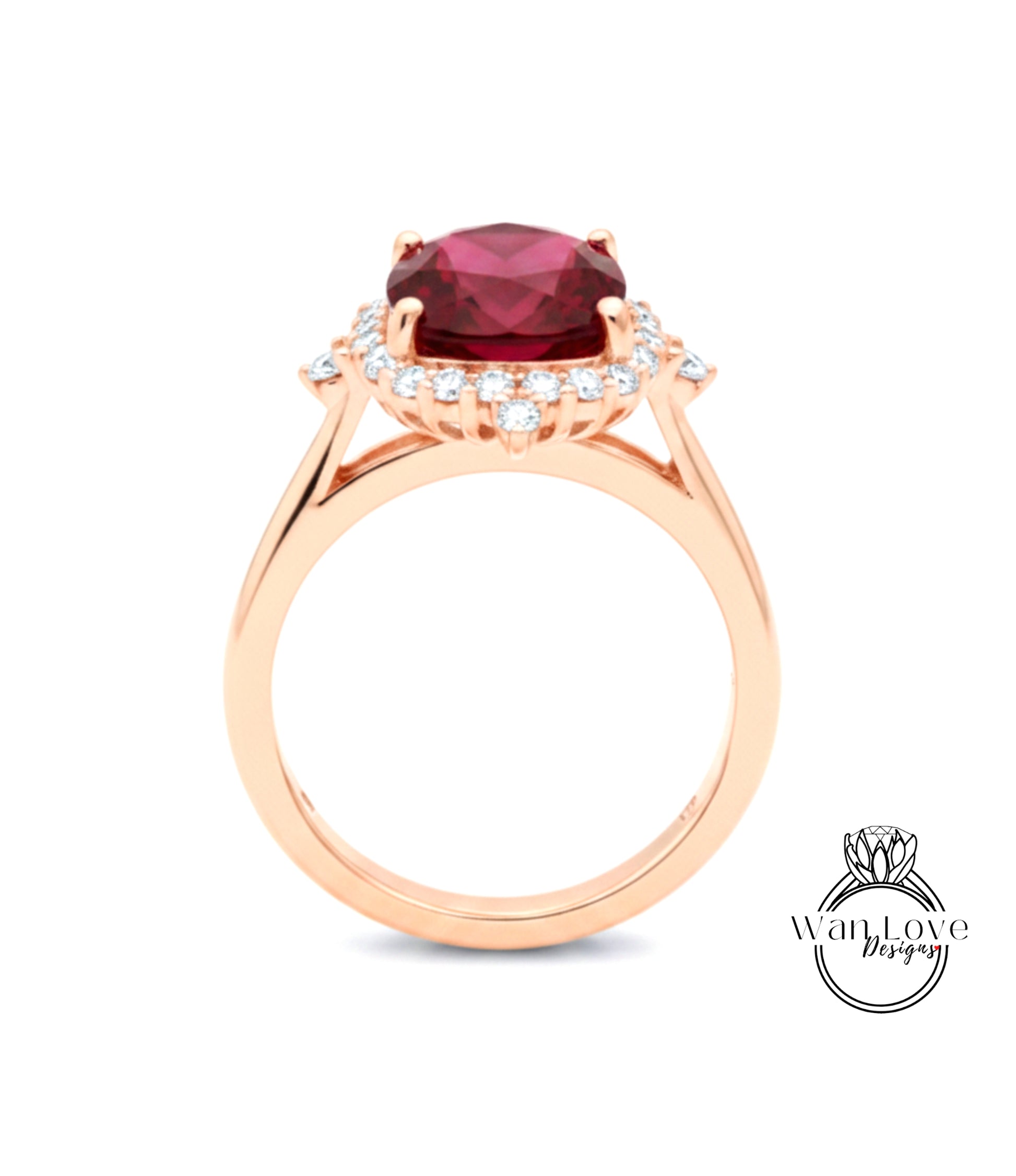 A gold ring with a large red gemstone, likely a ruby, set in a halo of smaller diamonds.