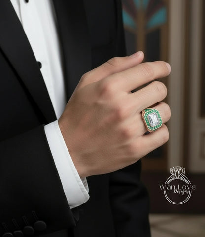 A close-up of a person's hand wearing a ring with a large green gemstone.