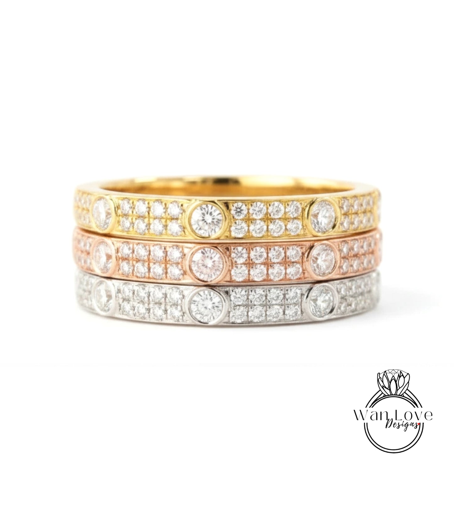 A ring with three concentric bands of diamonds in various colors, including gold, silver, and pink.