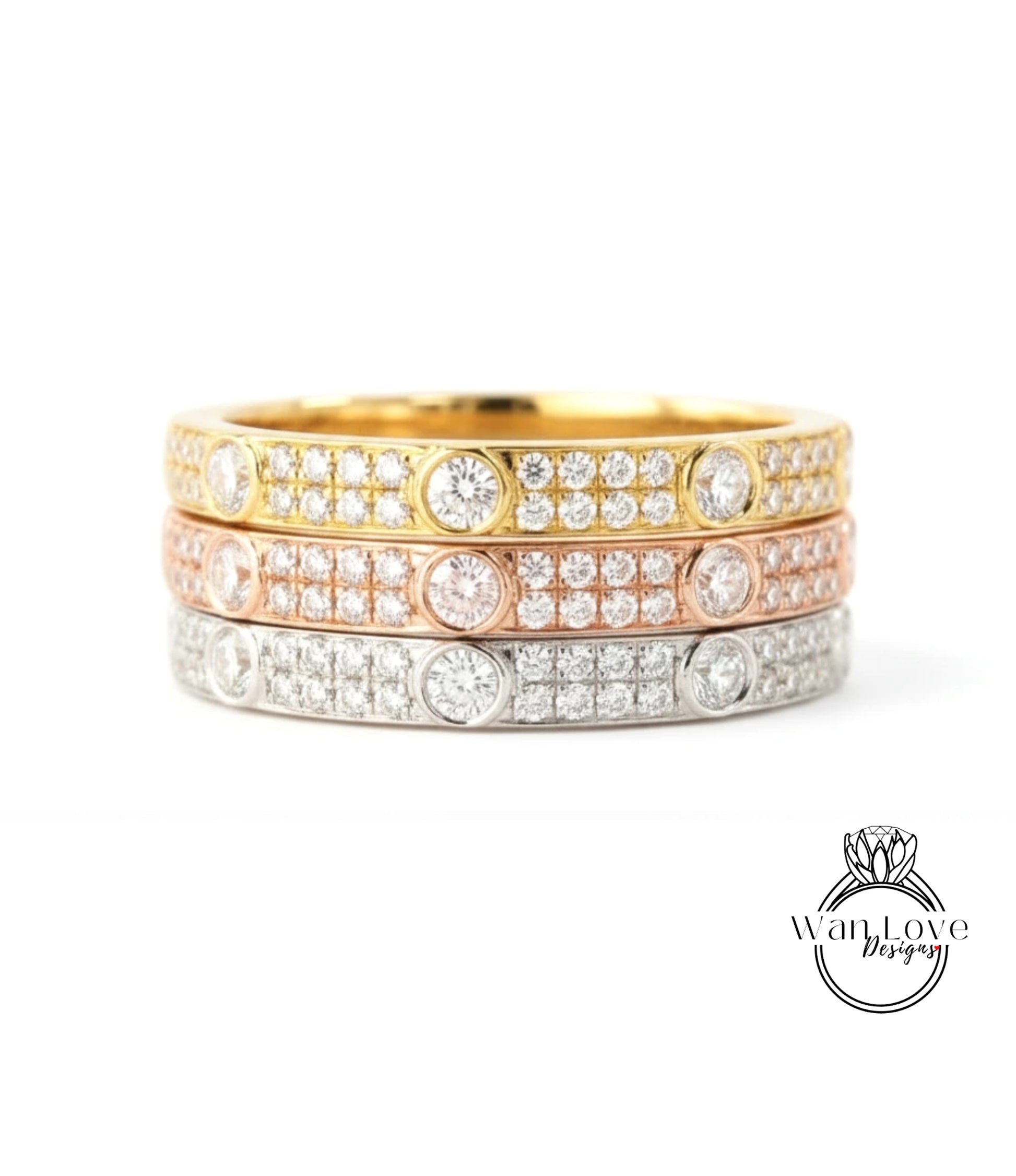 A ring with three concentric bands of diamonds in various colors, including gold, silver, and pink.
