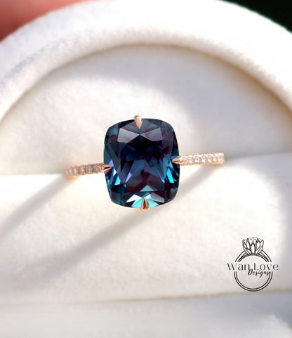 A close-up image of a ring with a large blue gemstone, likely a sapphire, set in a gold band.