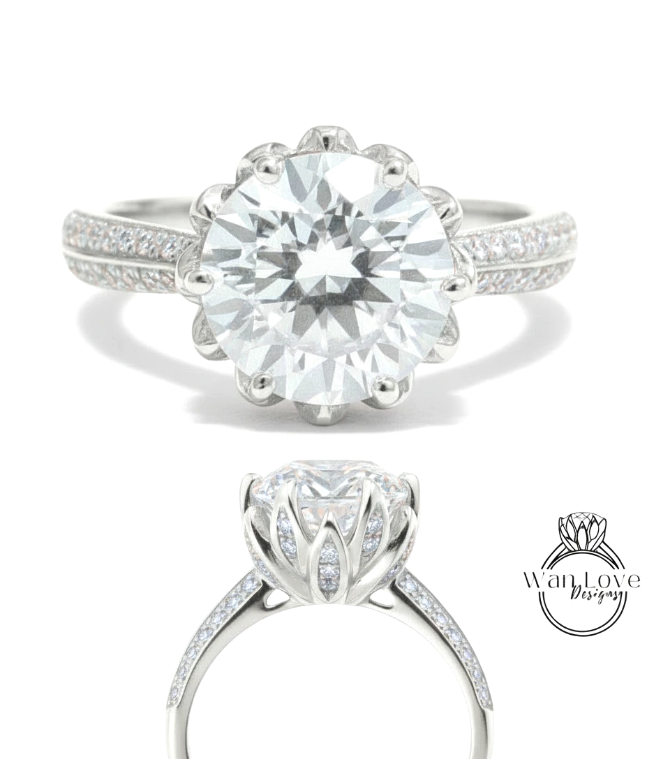 A stunning diamond engagement ring with a large round brilliant cut diamond set in a silver band adorned with small diamonds.