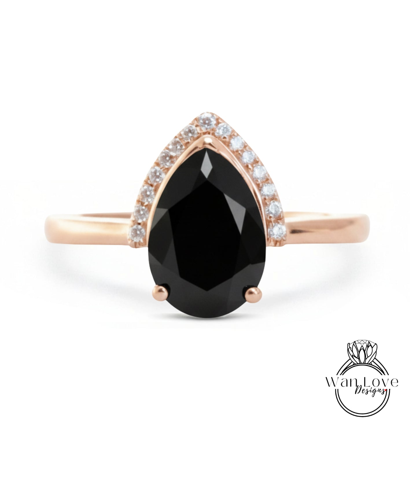 A gold ring with a large black gemstone, likely a diamond, set in the center.